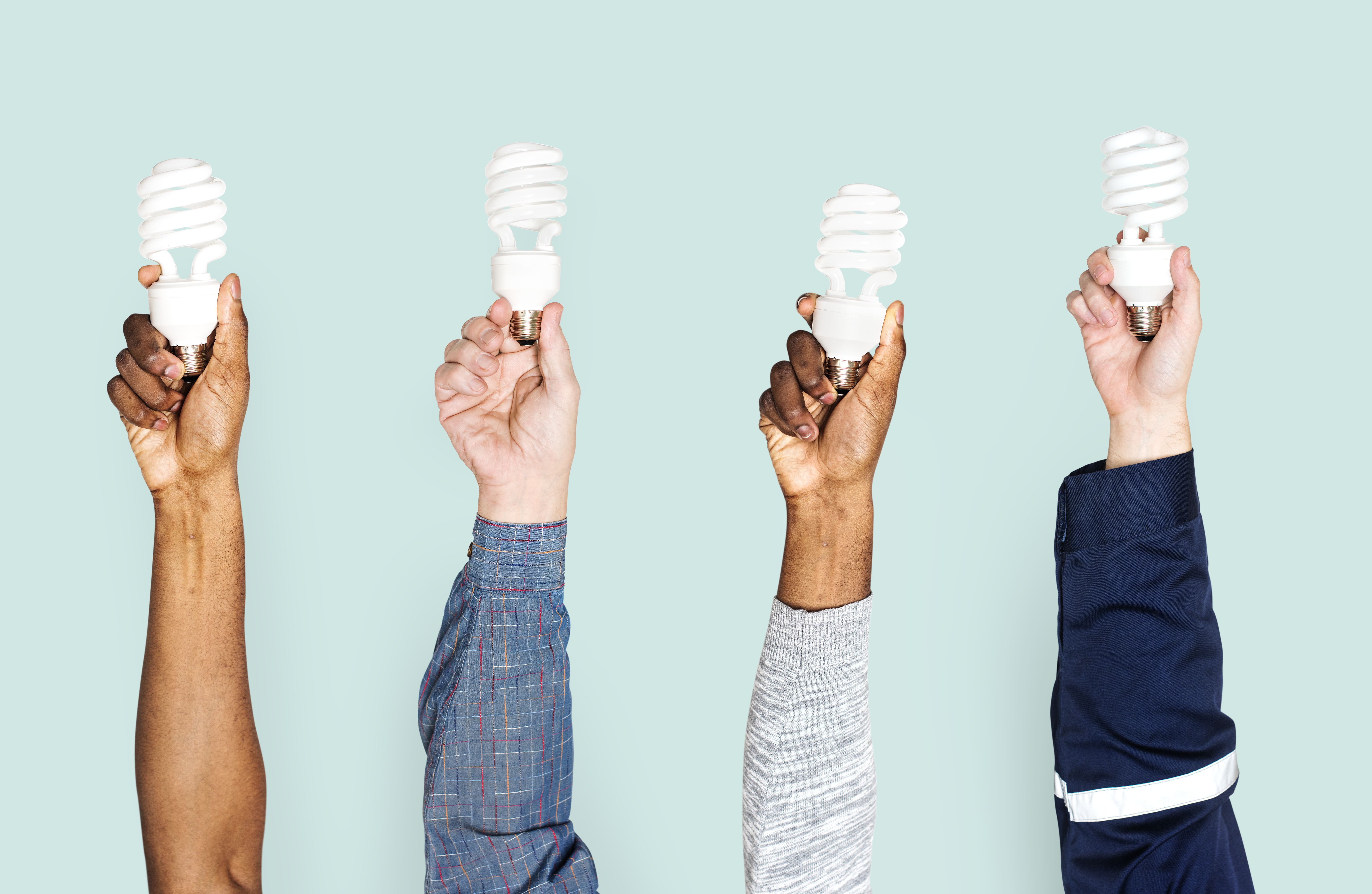 Hands holding LED lights, symbolizing sustainable energy choices